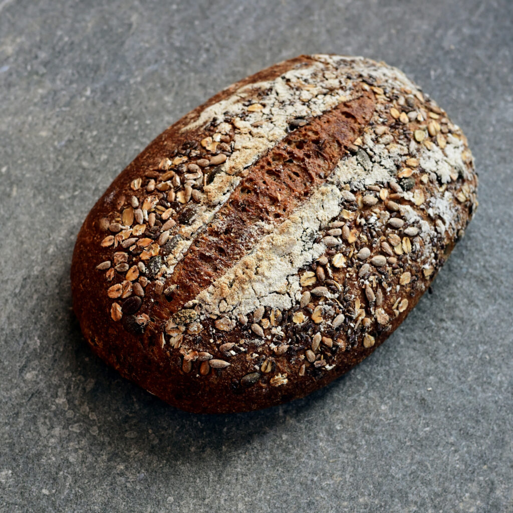 sourdough nutritious wholemeal seed bread. Stone-ground organic flour. No preservative
